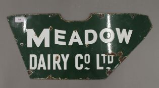 A Meadow Dairy Co Ltd enamel shop bicycle sign. 58 cm long.