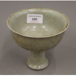 A Chinese celadon stem cup. 11.5 cm high.