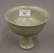 A Chinese celadon stem cup. 11.5 cm high.