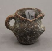 An Antiquity pottery jug. 6 cm high.