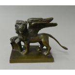 A Victorian bronze model of a winged lion. 19 cm long.