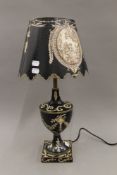 A black tole lamp. 56 cm high.