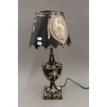 A black tole lamp. 56 cm high.