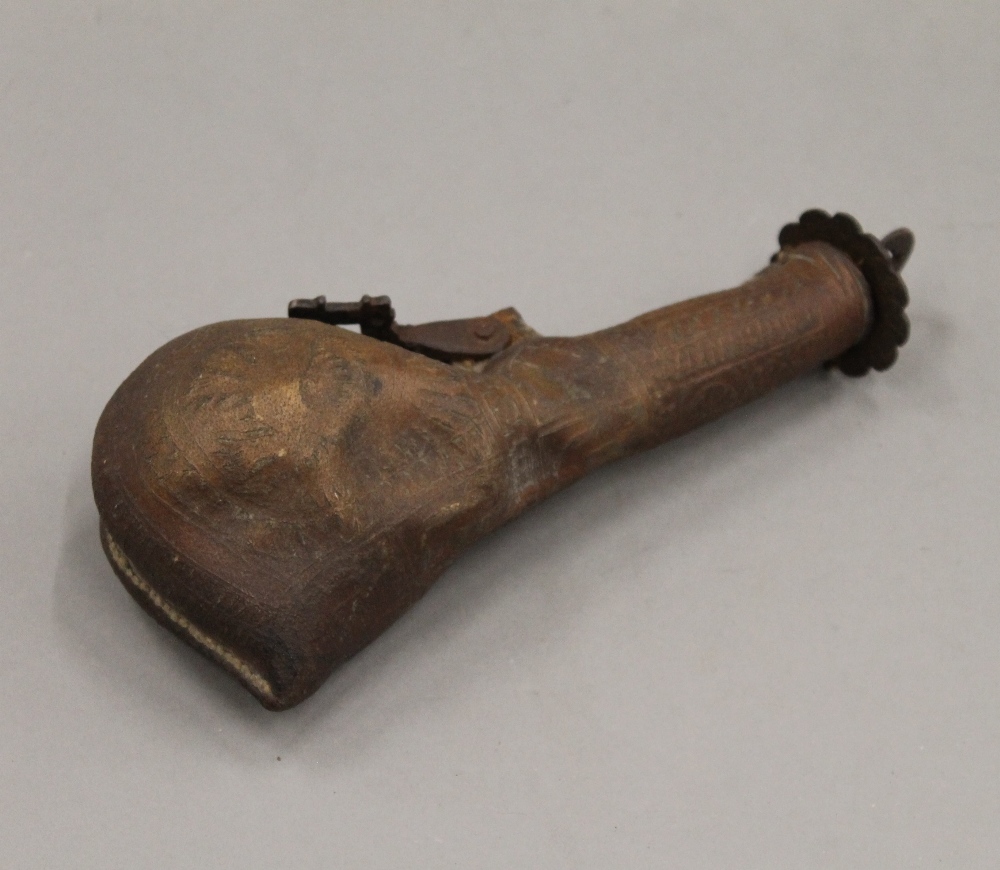 An antique camel scrotum powder flask. 20.5 cm high.