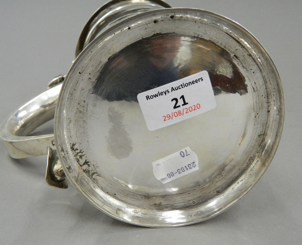 A George II silver lidded tankard, hallmarked for London 1742, maker's mark of F Spilsbury. 17. - Image 10 of 11