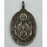 A Russian icon pendant. 5 cm high.