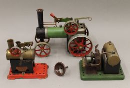 A Mamod traction engine and two stationary engines.