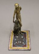 A cold painted bronze model of a girl and a leopard. 16.5 cm high.