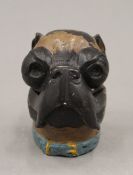 A cold painted bronze inkwell formed as a pug dog. 9 cm high.