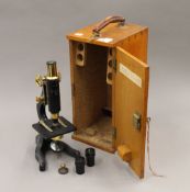 A vintage W F Stanley & Co microscope, in fitted case. The case 35 cm high.