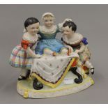 A Victorian porcelain figural group. 18 cm high.