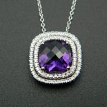An 18 ct white gold quality amethyst and diamond pendant, on a 18 ct white gold chain.