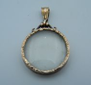 An Edwardian 9 ct rose gold double sided photo locket (4.