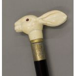 A walking stick with a carved bone handle formed as a rabbit. 92 cm long.