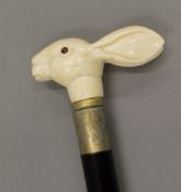 A walking stick with a carved bone handle formed as a rabbit. 92 cm long.