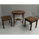 An Edwardian mahogany side table and two modern coffee tables.