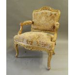 A 19th century gilt framed open armchair. 66 cm wide.