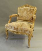 A 19th century gilt framed open armchair. 66 cm wide.