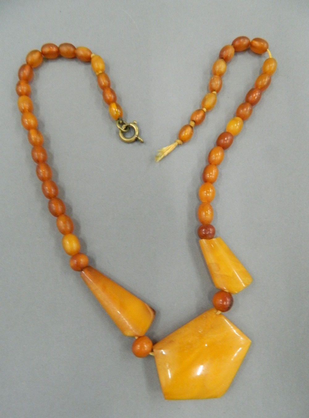 An amber bead necklace and two others. The largest 48 cm long. - Image 12 of 15