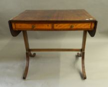 An early 20th century mahogany sofa table. 86.5 cm flaps down.