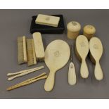 A quantity of Victorian ivory and other dressing table items
