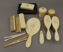 A quantity of Victorian ivory and other dressing table items