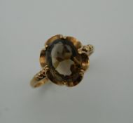 A 9 ct gold citrine ring. Ring Size M (2.