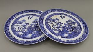 A pair of Willow pattern ceramic wall chargers. 43 cm diameter.