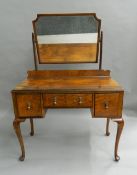 An early 20th century walnut dressing table. 102 cm wide.