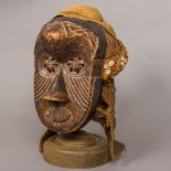 A carved wooden tribal Ba-kuba,