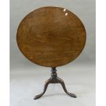 A mahogany tilt top tripod table. 83 cm wide.