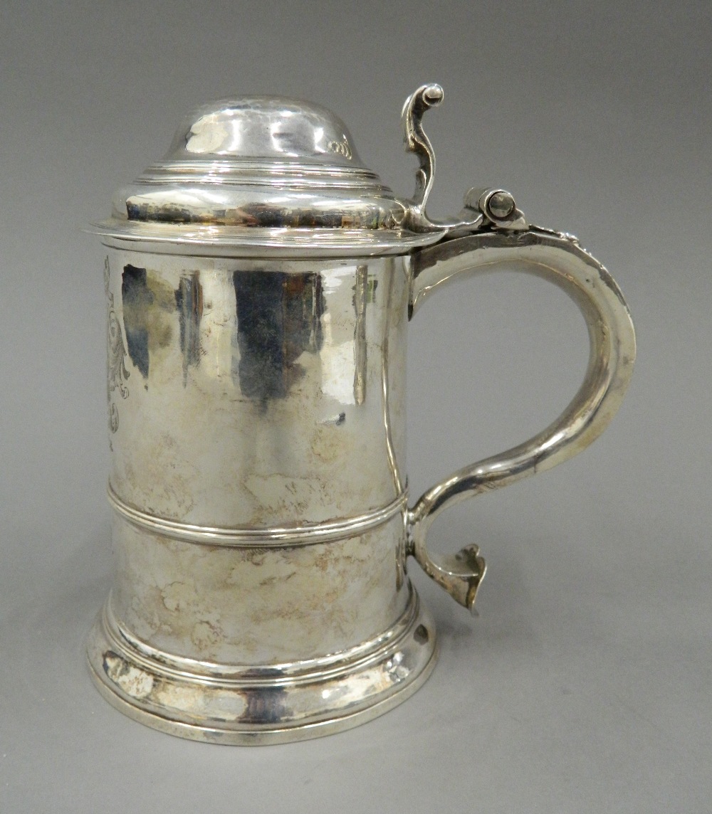 A George II silver lidded tankard, hallmarked for London 1742, maker's mark of F Spilsbury. 17. - Image 3 of 11