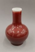 A Chinese Sang De Boeuf vase, with four character mark to base. 27.5 cm high.