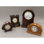 Four various mantle clocks. The largest 33 cm high.