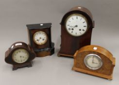 Four various mantle clocks. The largest 33 cm high.