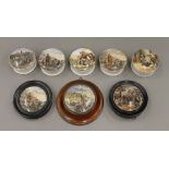 A collection of Victorian Prattware pot lids and pots.