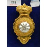 A cased military badge. 10.5 cm high.