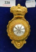 A cased military badge. 10.5 cm high.