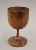 A pitch pine turned goblet. 17 cm high.