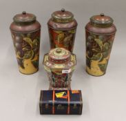 A collection of various tins. The three largest, each 29.5 cm high.