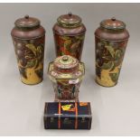 A collection of various tins. The three largest, each 29.5 cm high.