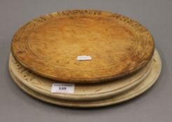 Three vintage bread boards. The largest 30 cm diameter.