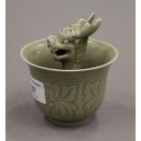 A celadon dragon cup. 10 cm high.