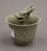 A celadon dragon cup. 10 cm high.