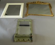 A gilt framed mirror and two other mirrors. The former 97 cm wide.