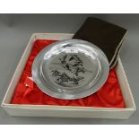 A silver dish decorated with geese by PETER SCOTT, boxed. 20 cm diameter (6 troy ounces).