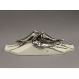 An Art Deco porcelain group of silvered swallows. 47.5 cm wide.