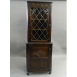 An Old Charm type oak corner cabinet. 182.