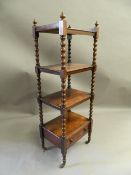 A Victorian rosewood whatnot. 127 cm high.