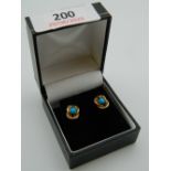 A pair of 9 ct gold and turquoise earrings. 1 cm high (2.